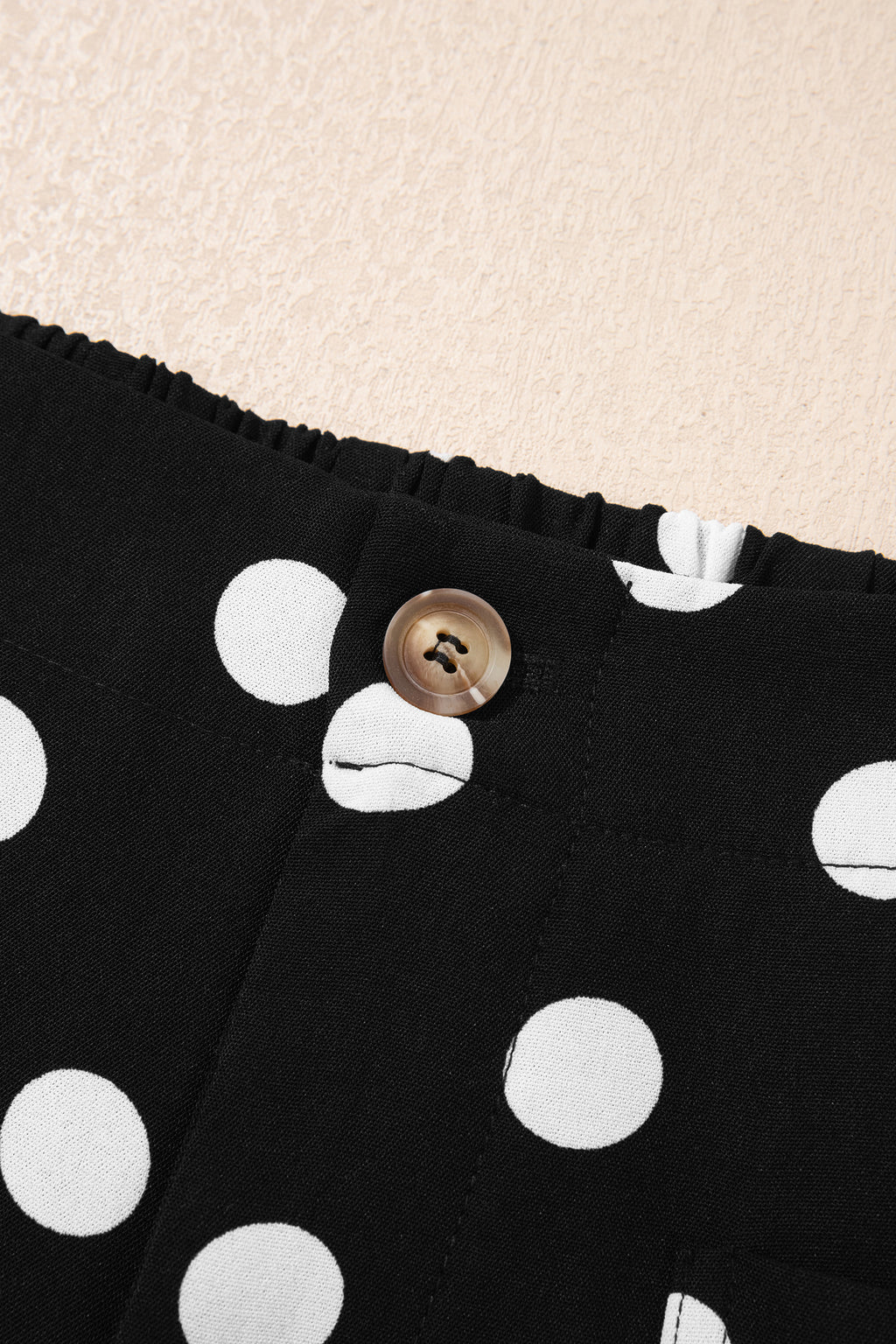 Black polka dot print patched pocket mid-rise straight leg pants by Dear-Lover, shown from the front.