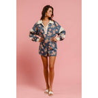 WASHED FLORAL DENIM ROMPER WITH CONTRAST COLLAR