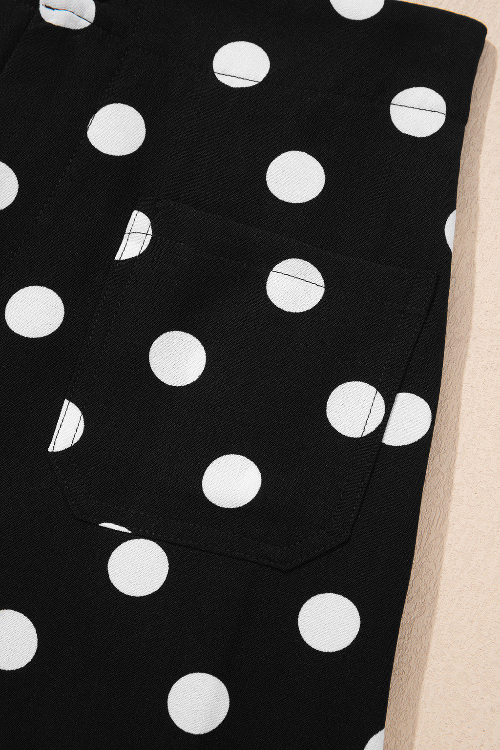 Black polka dot print patched pocket mid-rise straight-leg pants by Dear-Lover, featuring a stylish polka dot pattern and casual fit.