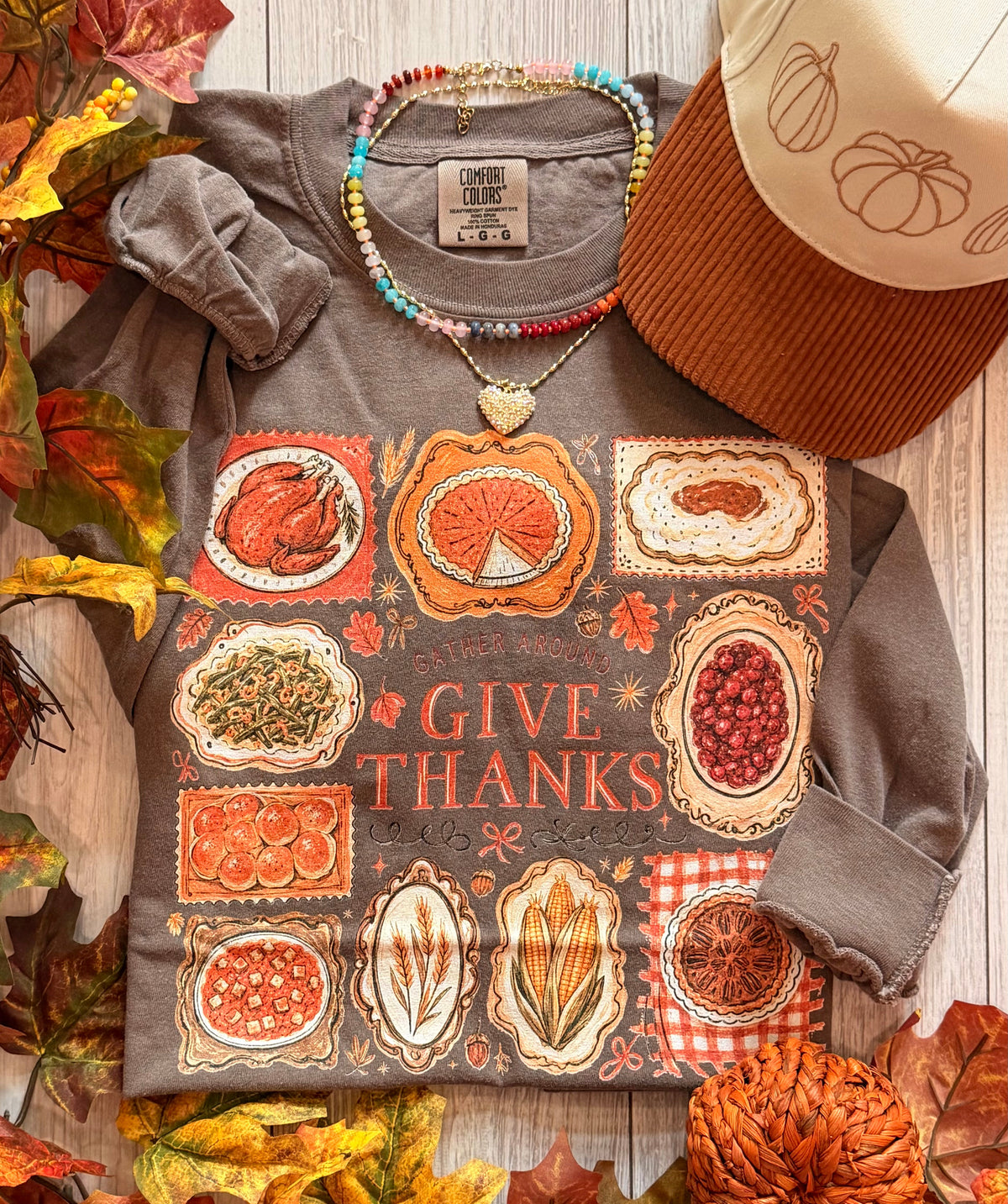 Gather Around Give Thanks tee from P&PD Wholesale, featuring festive fall design on a comfortable long sleeve shirt.