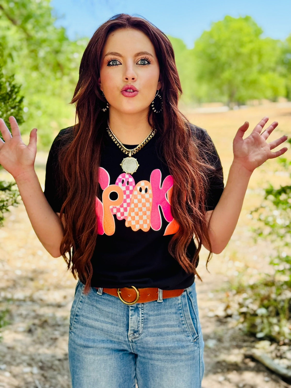 Black Spooky Tee in Glitter Puff by Texas True Threads featuring spooky graphic and glitter puff lettering on soft cotton fabric.
