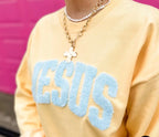 Jesus fluffy patch on yellow haze sweatshirt from Al + Gray Graphic Tees, featuring a soft embroidered Jesus design.
