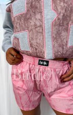 Pink camo boxer shorts by Bird & Co Wholesale Tees, soft fabric with a comfortable fit and camo pattern.