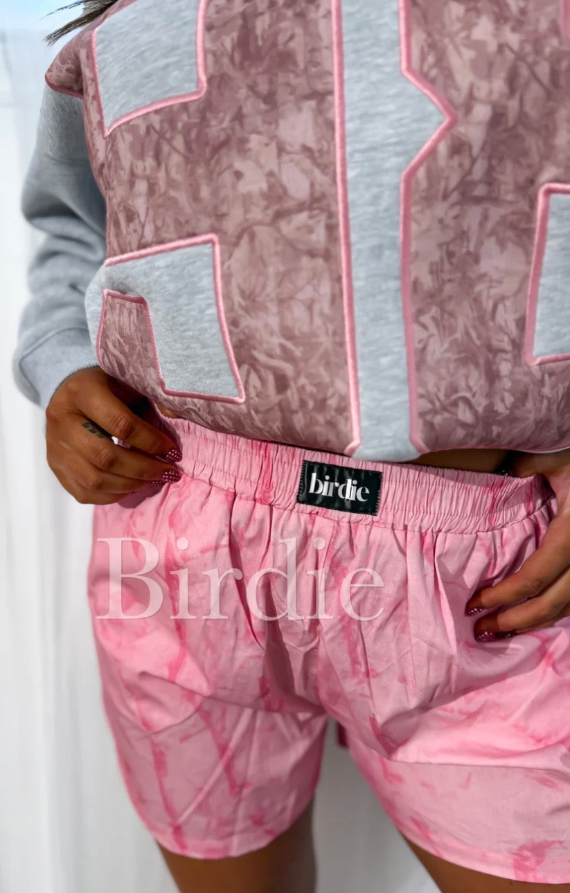 Pink camo boxer shorts by Bird & Co Wholesale Tees, soft fabric with a comfortable fit and camo pattern.