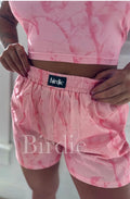 Pink camo boxer shorts from Bird & Co Wholesale Tees, with a comfortable fit and camouflage pattern.