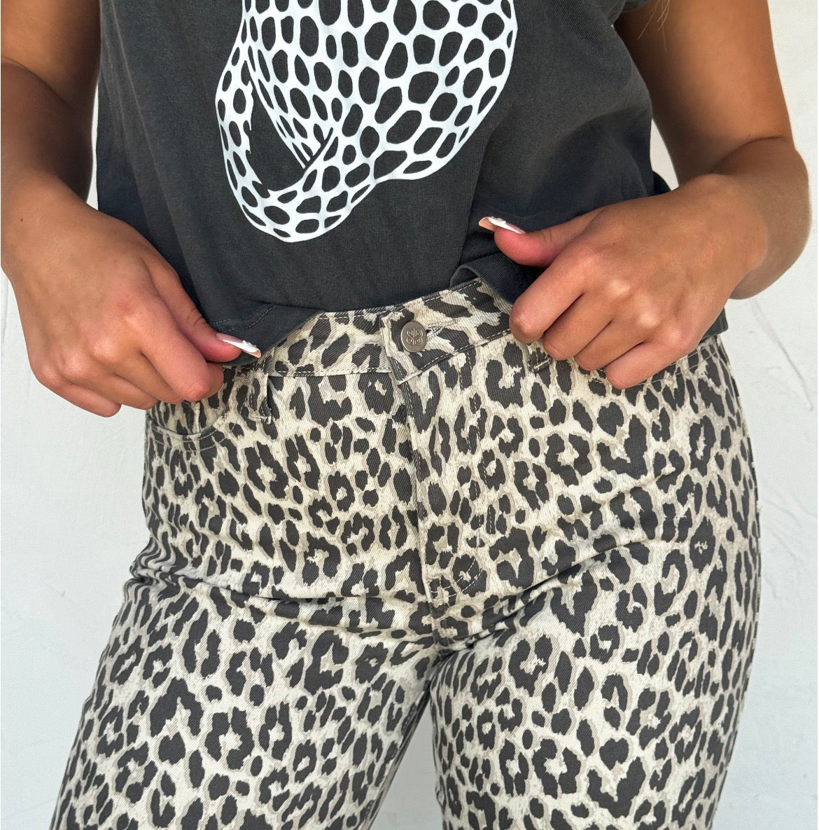 BLAKELEY cheetah and leopard print non-distressed jeans, stylish bottoms with animal print pattern and classic denim fit.
