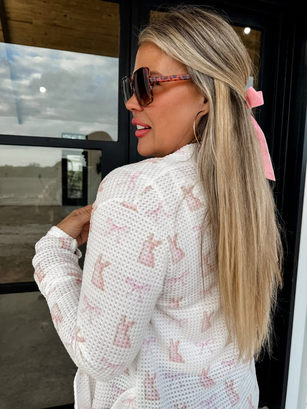 Pink Spring Lola Cardigan by BLAKELEY, lightweight knit with long sleeves and button closure, displayed on a neutral background.