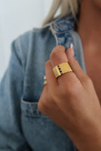 Close-up of the Chansuttpearls Sadie Ring featuring a pearl centerpiece and delicate band on a white background.