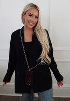 Black phone chain by Chansuttpearls featuring a stylish design, perfect for securing and accessorizing smartphones.