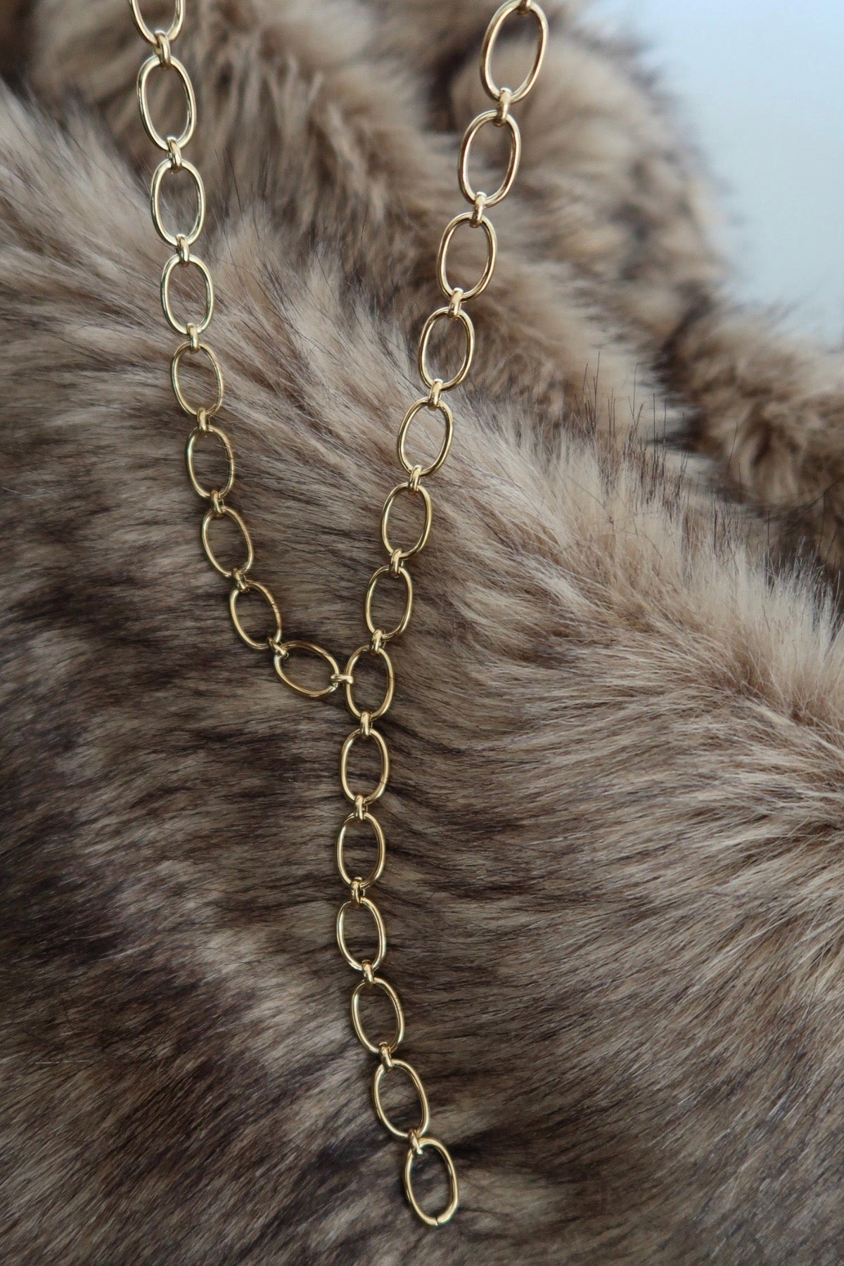 Elegant BRYNN Necklace by Chansuttpearls with lustrous pearls and delicate silver chain, displayed on a neutral background.