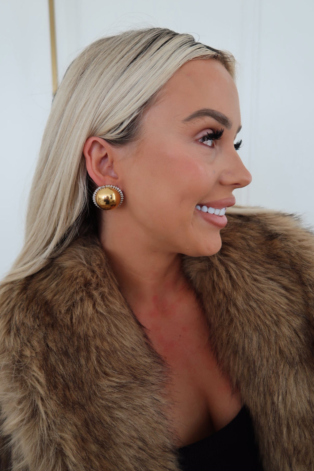 Chansuttpearls Clara earrings featuring elegant pearl drop design with gold accents, perfect for sophisticated jewelry styling.