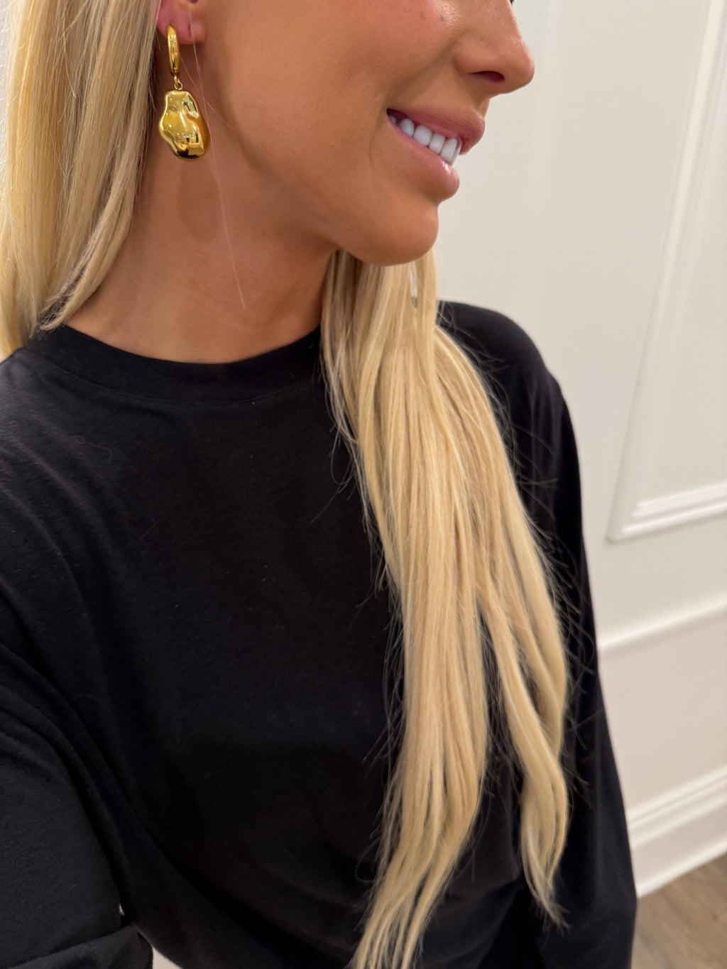 Gold Sadie earrings by Chansuttpearls featuring elegant, dangling pearl accents on a sleek gold setting.