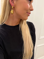 Gold Sadie earrings by Chansuttpearls featuring elegant drop design and shiny gold finish.