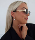 Chansuttpearls Hazel earrings featuring pearl embellishments and elegant design on a neutral background.