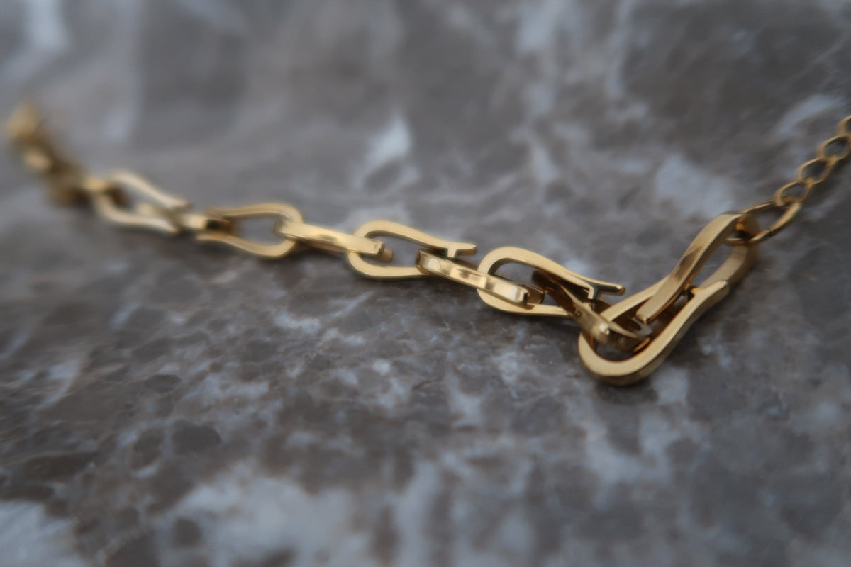 Chansuttpearls Kendall bracelet featuring elegant pearl strands and gold-tone accents on a delicate jewelry design.