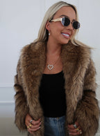 Large diamond heart necklace from Chansuttpearls featuring a sparkling heart-shaped pendant on a delicate chain.