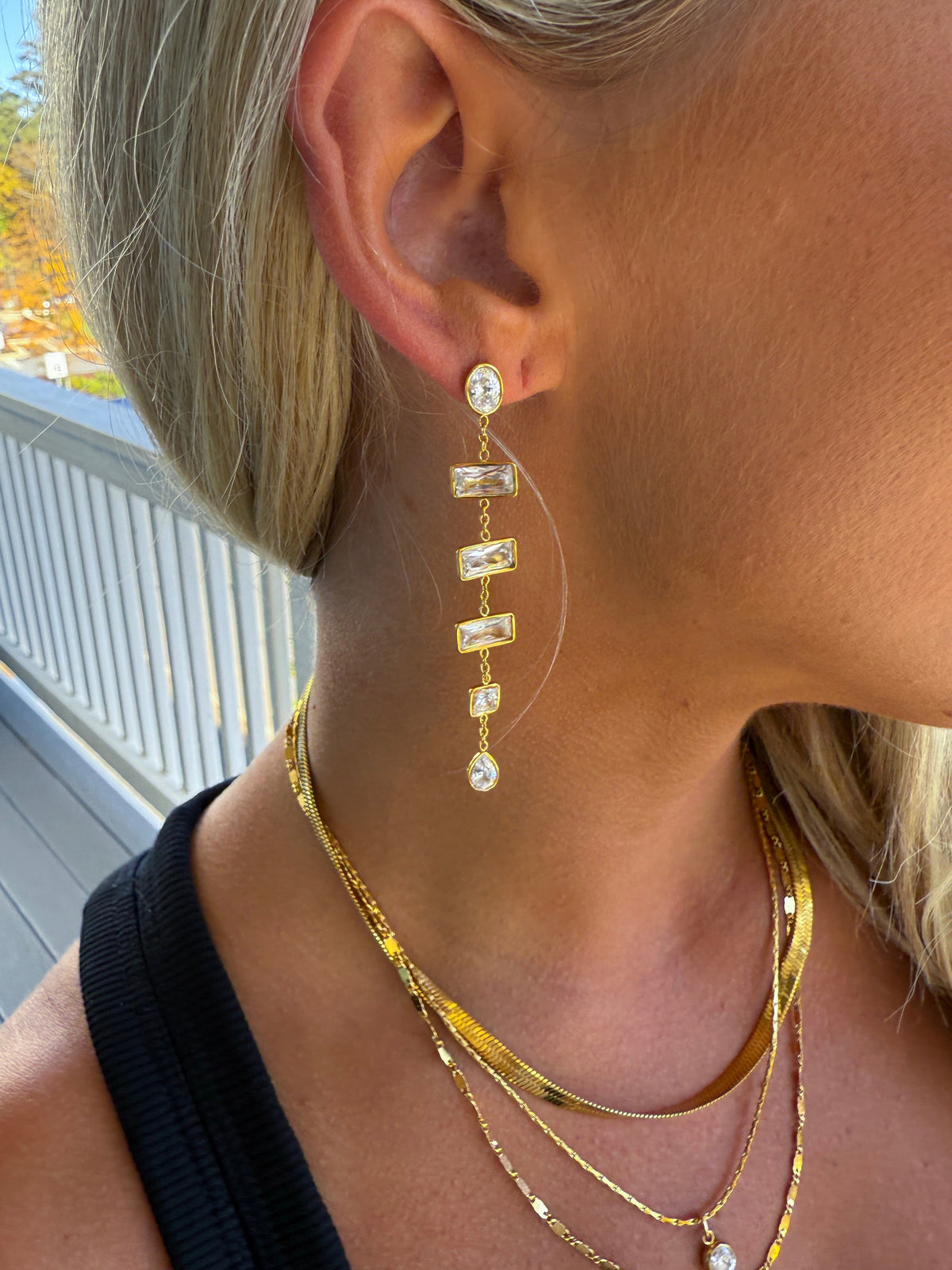 Chansuttpearls Layla earrings featuring elegant pearl drop design with gold accents on a white background.