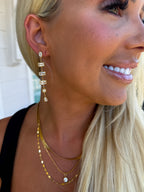 Chansuttpearls Layla earrings featuring elegant pearl design with gold accents, perfect for stylish occasions.