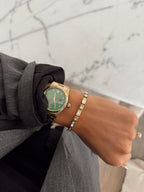 Elegant LUDA bracelet by Chansuttpearls featuring lustrous pearls and delicate design on a neutral background.