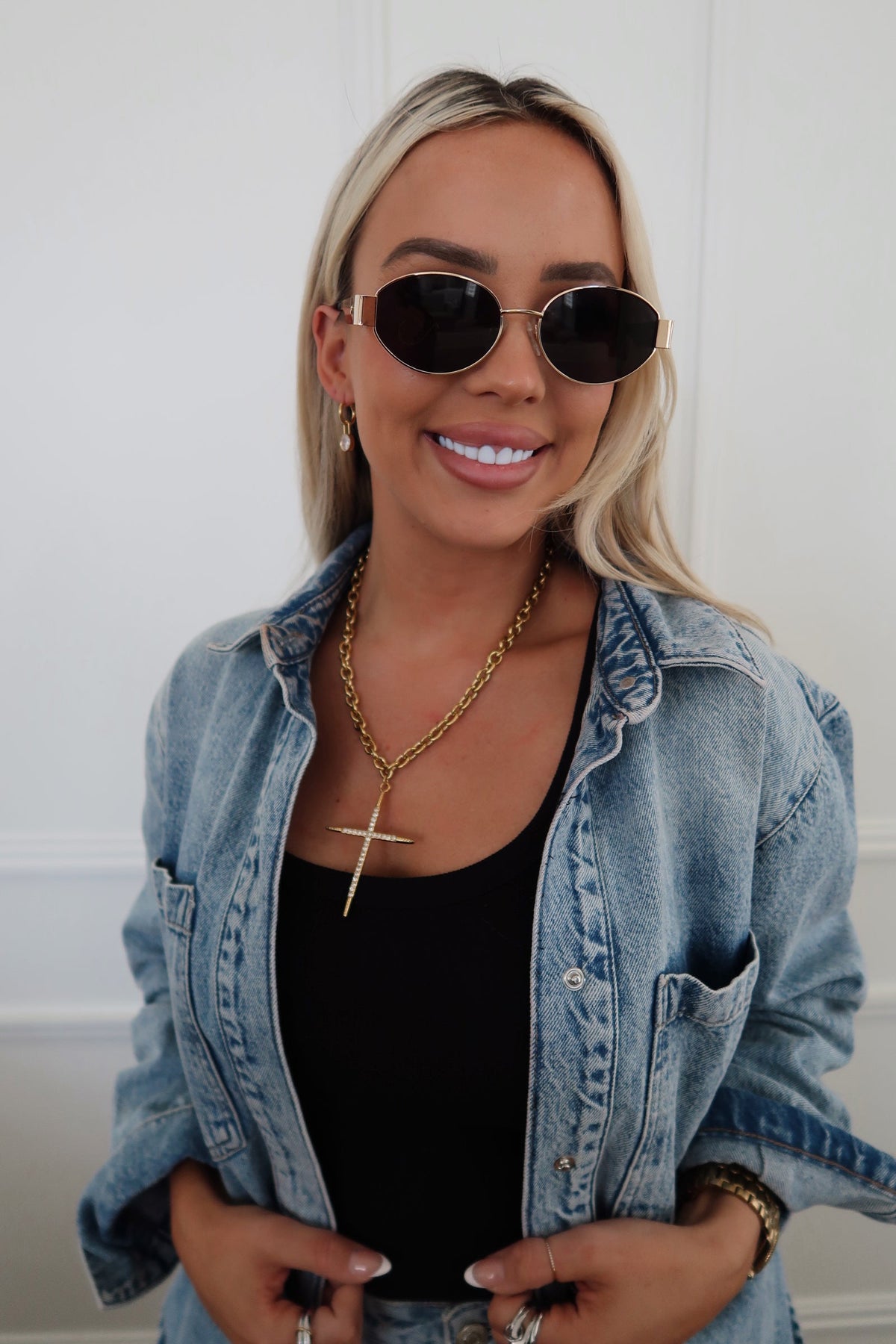 Gold-tone Luxe Cross Necklace by Chansuttpearls featuring a detailed cross pendant on a delicate chain.