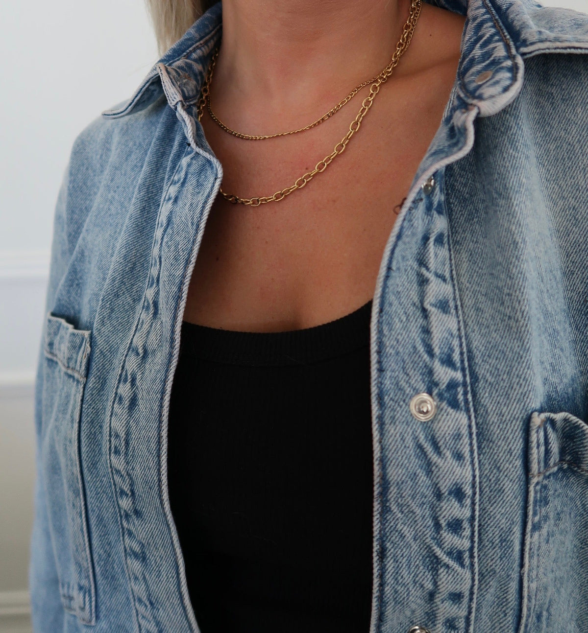 Chansuttpearls Mila Necklace featuring elegant pearl strands with a delicate clasp on a white background.