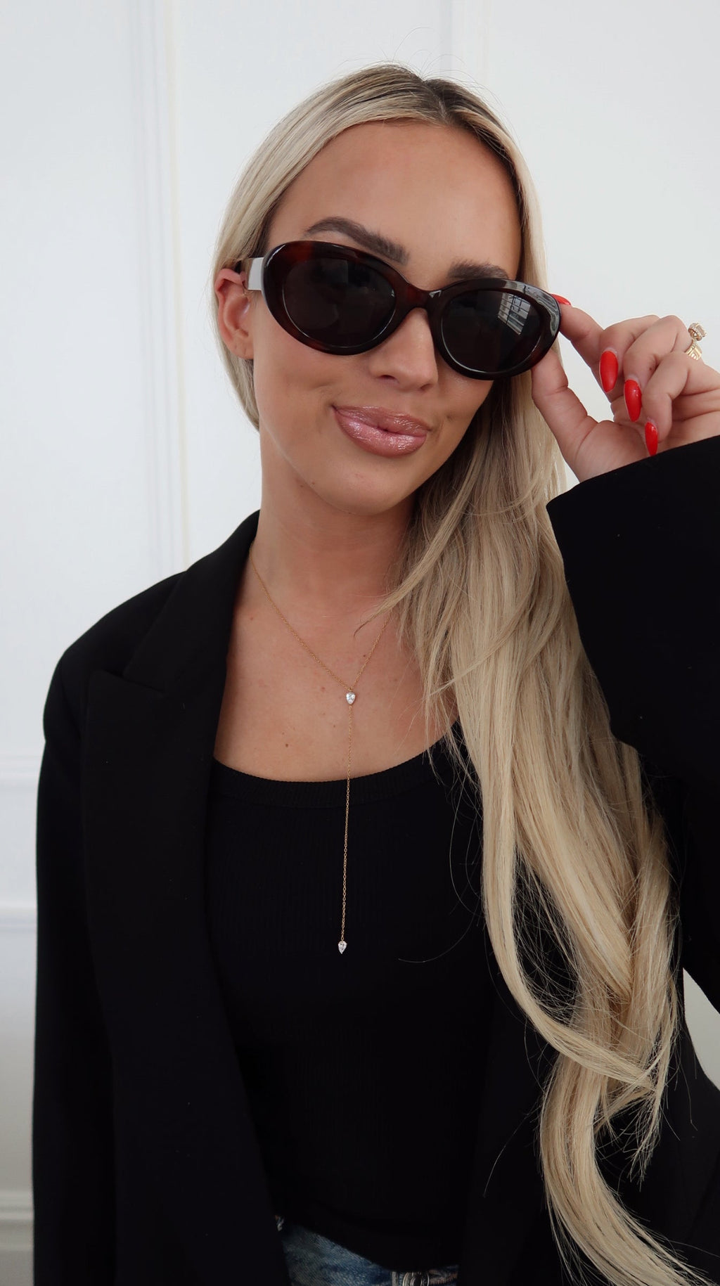 Chansuttpearls Natalie Necklace featuring elegant pearl strands and a delicate clasp, styled for sophisticated wear.