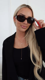 Chansuttpearls Natalie Necklace featuring elegant pearl strands and a delicate clasp, styled for sophisticated wear.