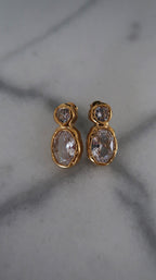 Chansuttpearls Serenity earrings featuring elegant pearl drop design with gold accents, on a white background.