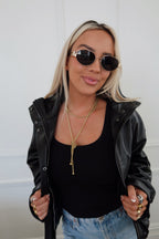 Small Alex necklace by Chansuttpearls featuring a delicate chain with a minimalist pendant on a white background.