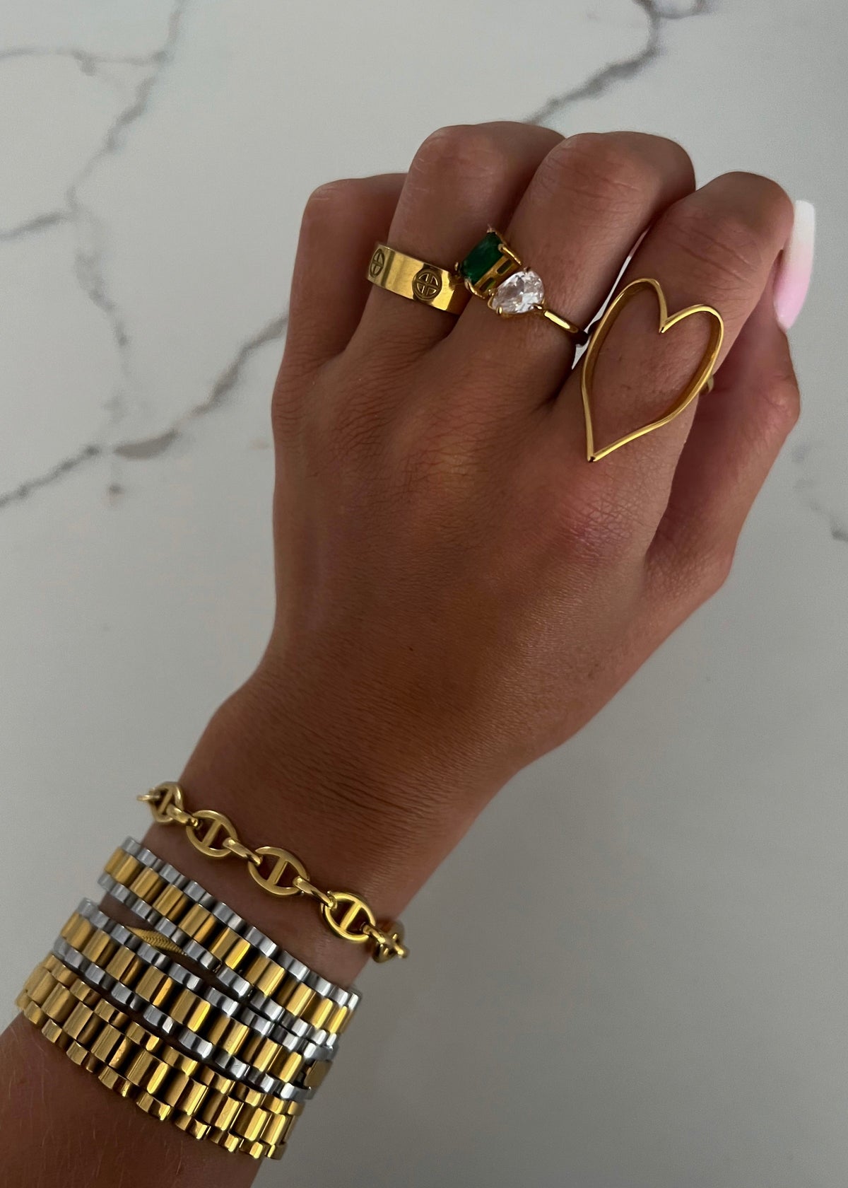 Gold heart ring from Chansuttpearls featuring a shiny gold band and a prominent heart-shaped design.