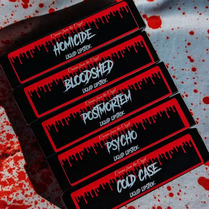 Crypt Cosmetics Bloodshed knife-shaped slasher liquid lipstick in dark red with a sharp, edgy design.