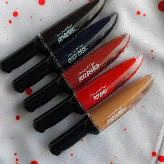 Crypt Cosmetics BLOODSHED knife-shaped slasher liquid lipstick in deep red, with a sleek, knife-inspired design on the tube.