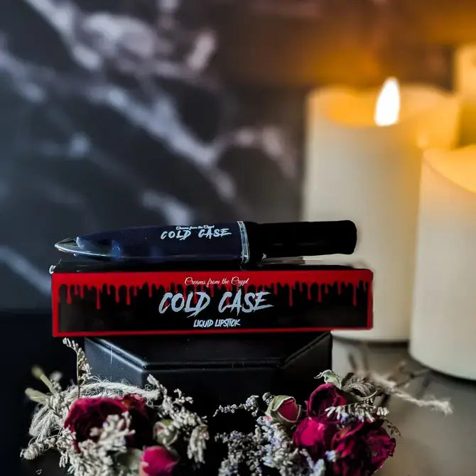 Crypt Cosmetics Cold Case knife-shaped slasher liquid lipstick in black with a sleek, knife-inspired design.