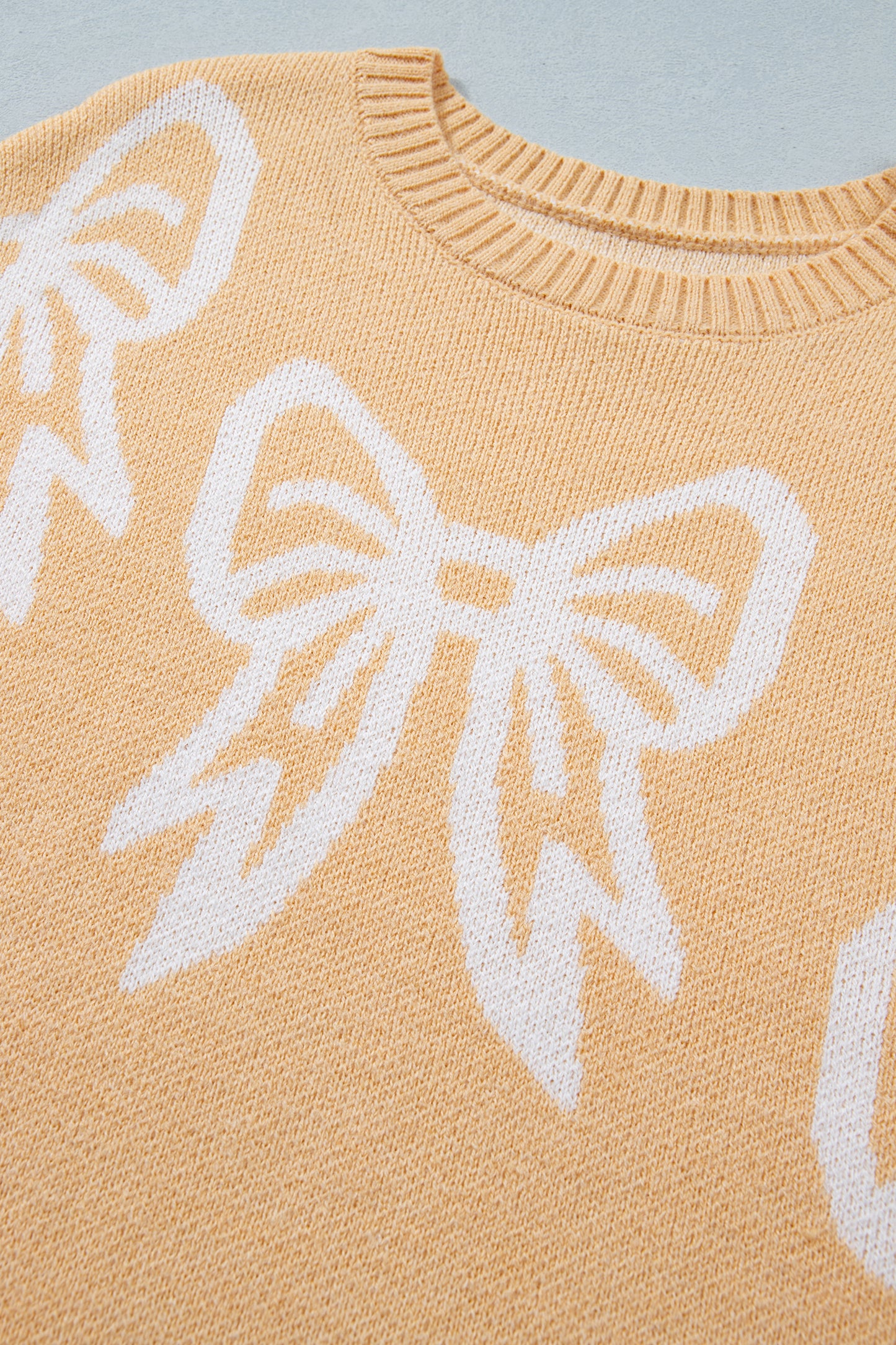 Golden Fleece Bow Pattern Drop Shoulder Loose Sweater