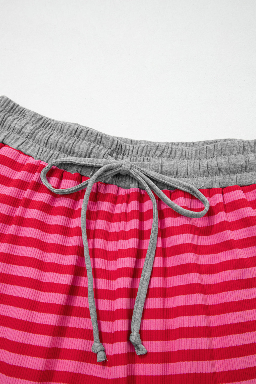 Rose stripe casual ribbed shorts with contrast elastic waist and polyester-elastane blend, designed for comfortable everyday wear.
