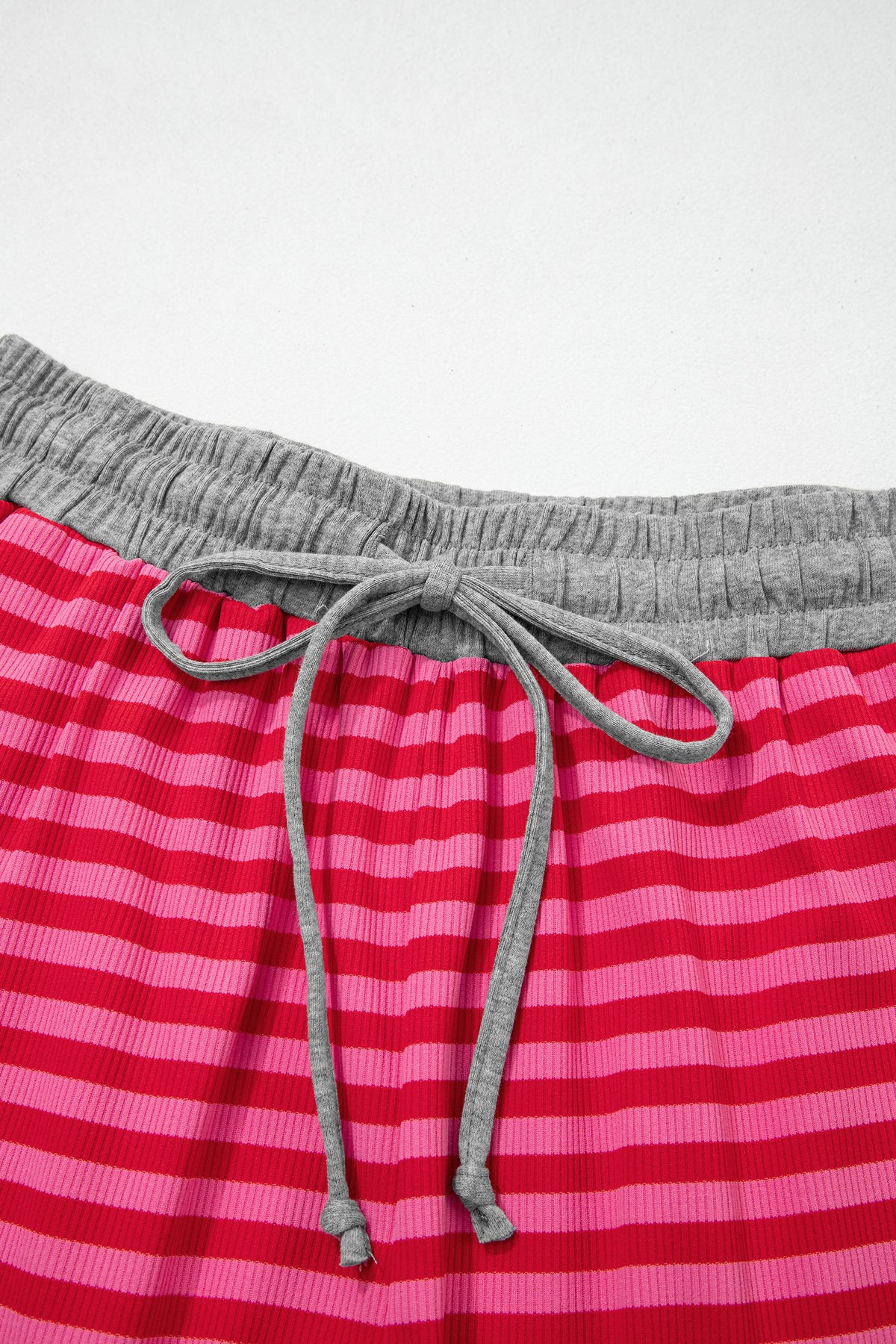 Rose stripe casual ribbed shorts with contrast elastic waist and polyester-elastane blend, designed for comfortable everyday wear.