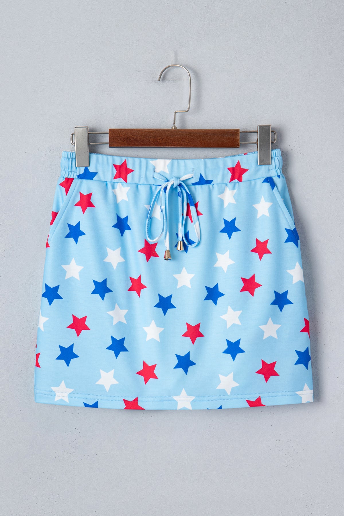 Sky blue patriotic star printed beaded drawstring mini skort by Dear-Lover, casual shorts with star pattern and elastic waistband.