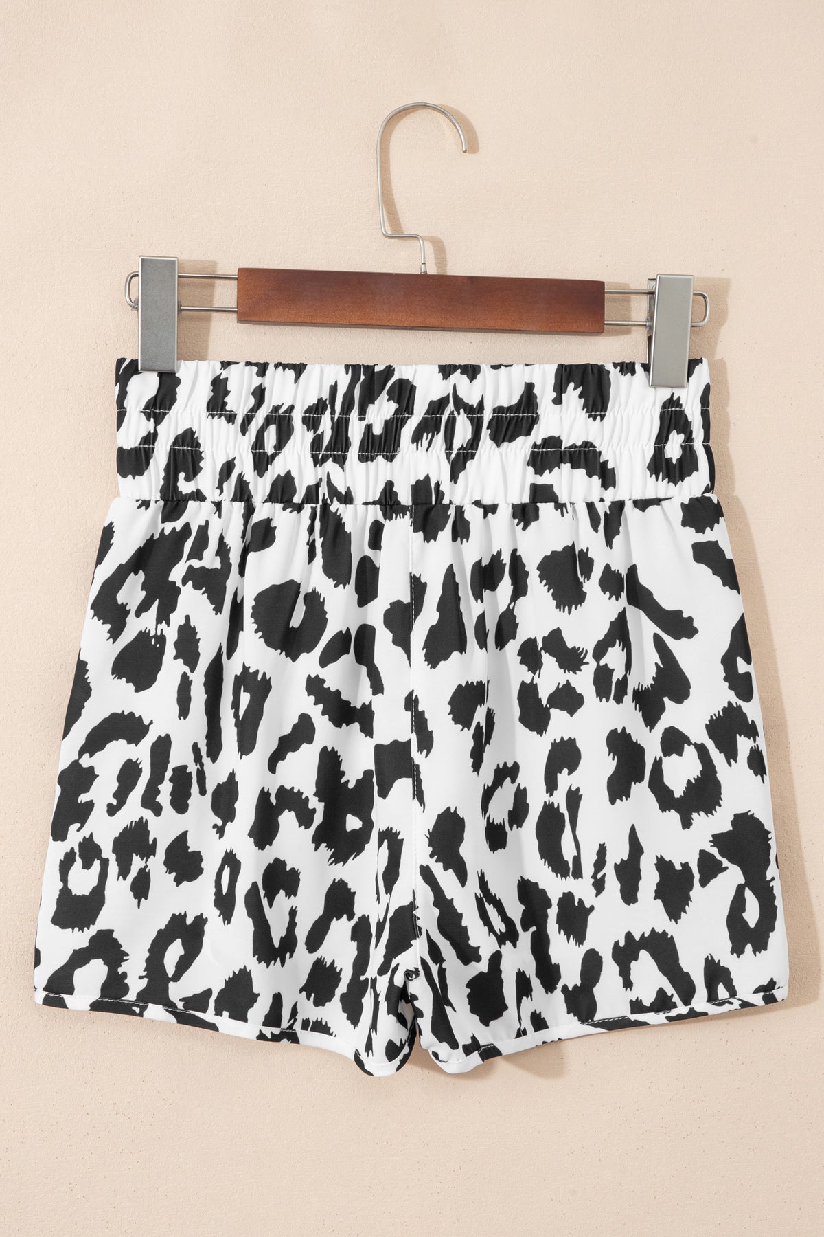 White leopard print high-waisted athletic shorts by Dear-Lover, casual bottoms made of lightweight polyester fabric.