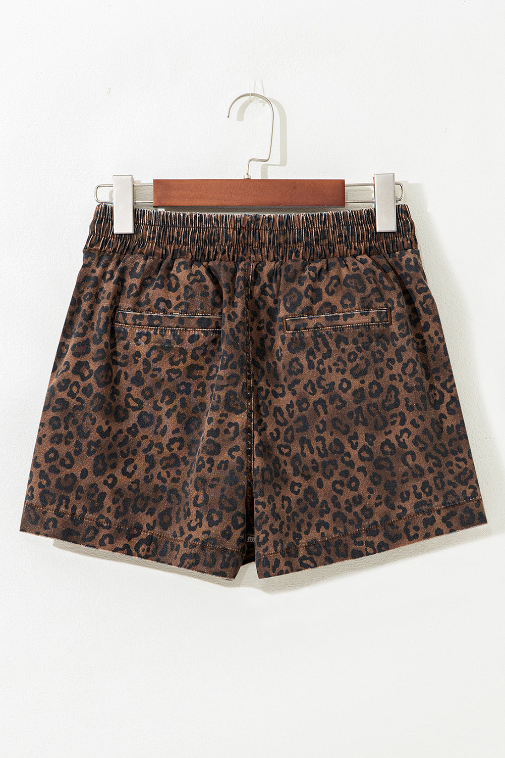 Brown leopard print denim skort with elastic waistband, drawstring, and cotton-elastane blend, perfect for casual wear.