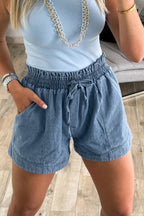 Dusk blue smocked elastic waist denim shorts by Dear-Lover, casual bottoms with a relaxed fit and cotton-polyester blend fabric.