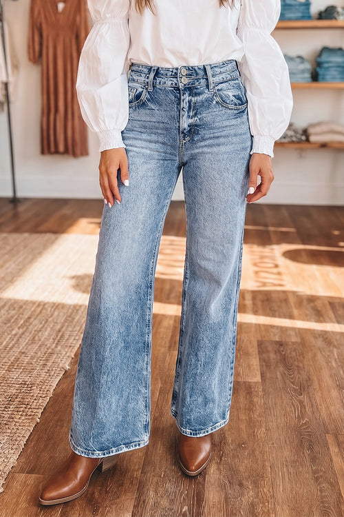 Beau Blue Acid Wash Flare Jeans by Dear-Lover with pocket details and a stylish fit, made from cotton, polyester, and elastane.