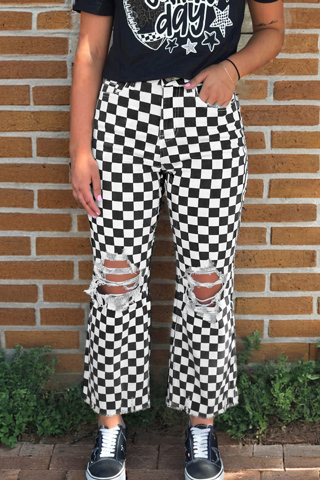 Black checkerboard print distressed raw edge cropped jeans by Dear-Lover Dropshipping, showcasing holes and a stylish raw hem.