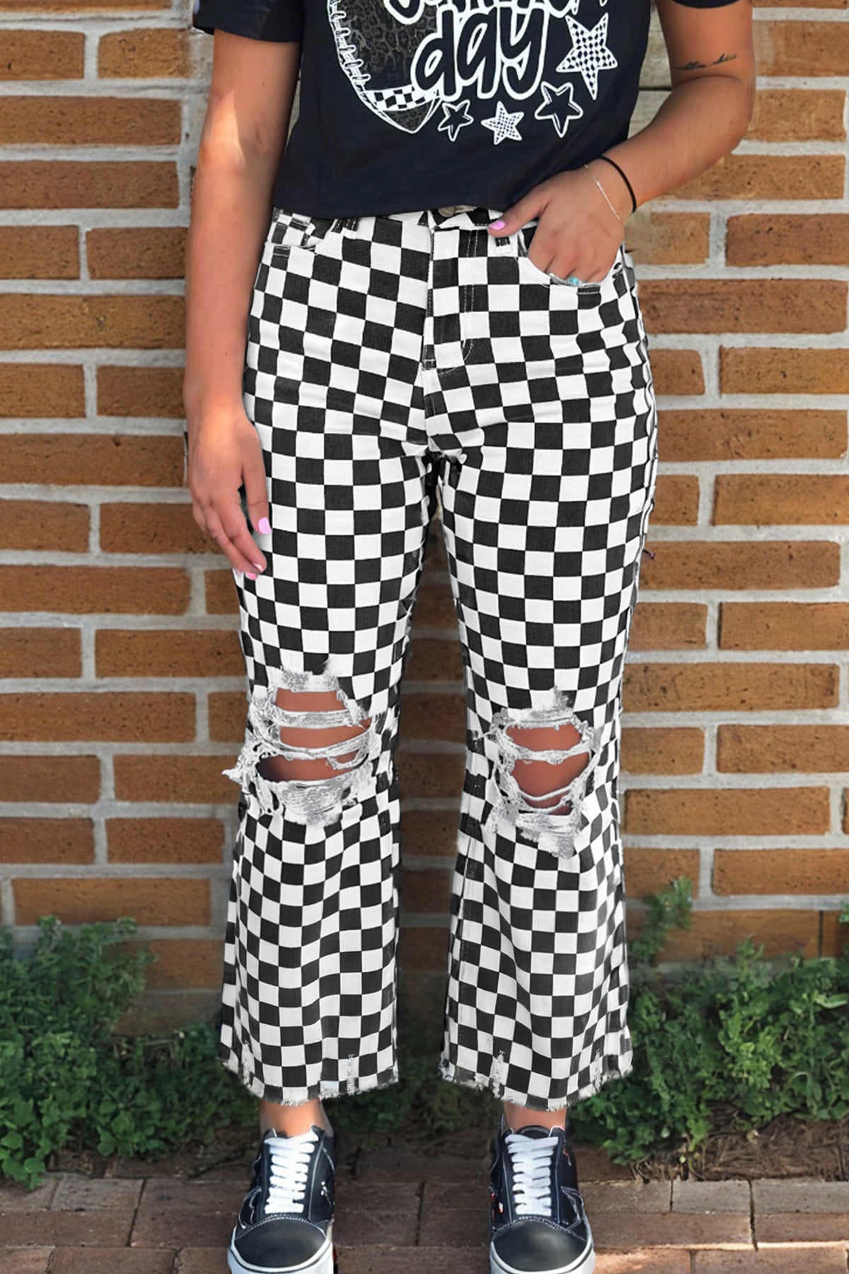 Black checkerboard print distressed raw edge cropped jeans by Dear-Lover Dropshipping, showcasing holes and a stylish raw hem.