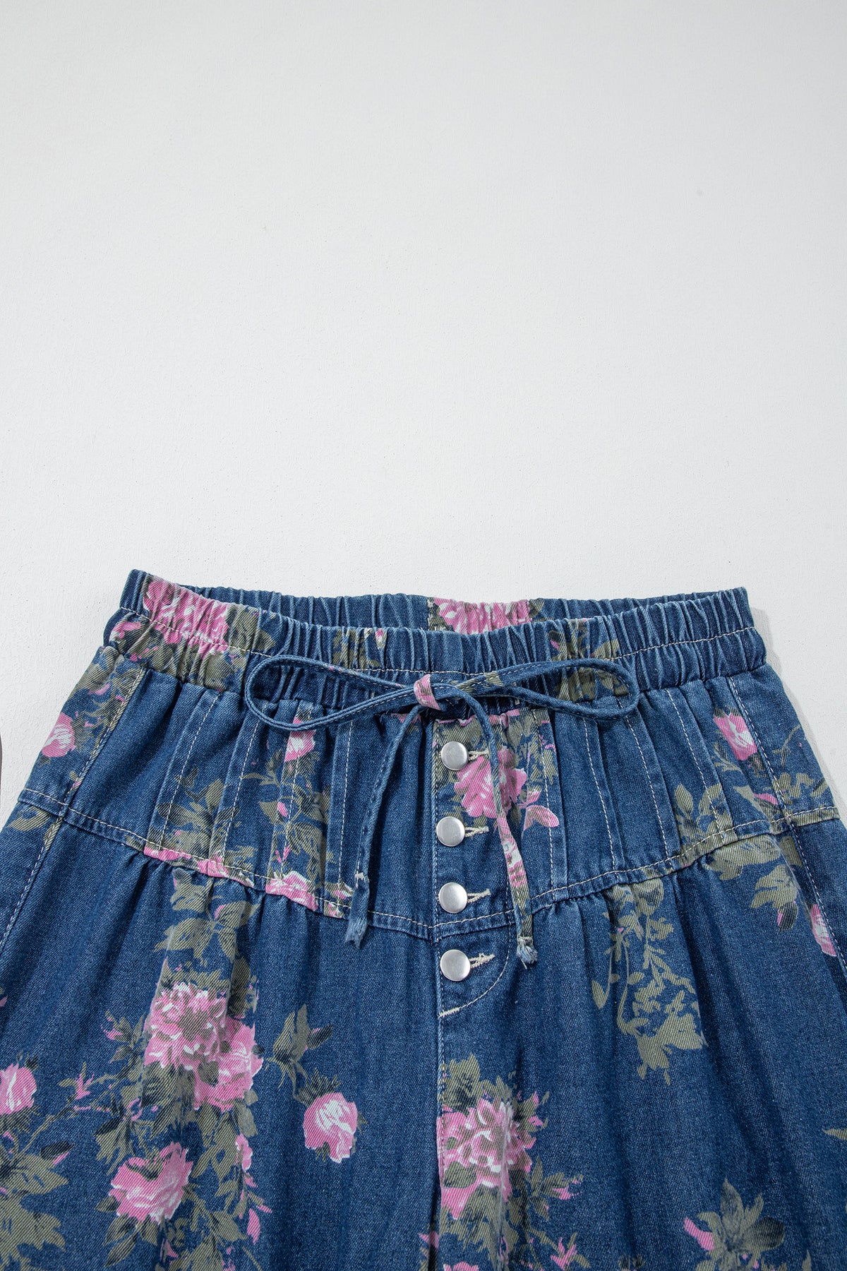 Blue retro floral print jeans with wide-leg, button detail, elastic waist, and pintuck design by Dear-Lover.