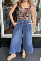 Dusk blue high-rise wide-leg denim pants with pleats, buttons, and cropped length by Dear-Lover, made of cotton and polyester.