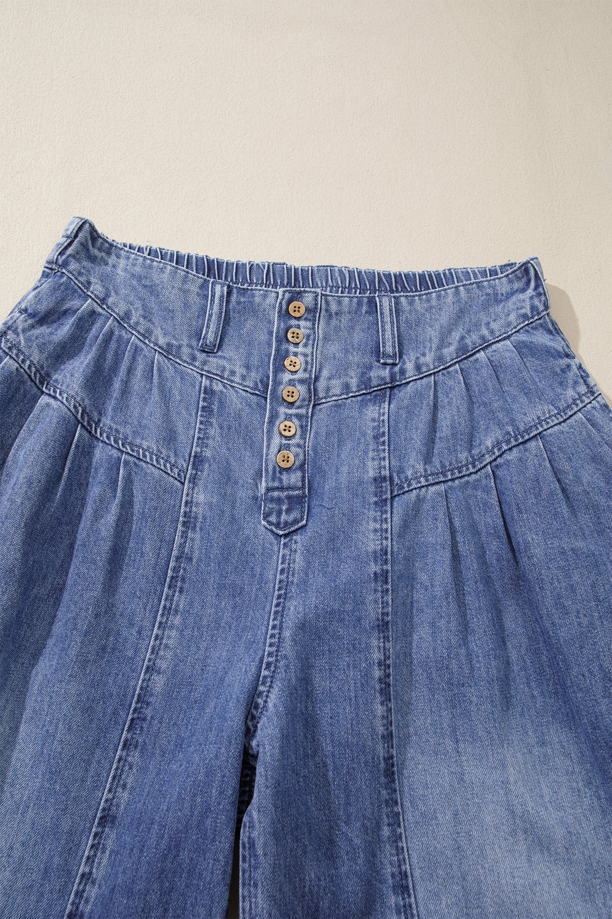 Dusk blue high-rise denim jeans with buttons, pleated design, cropped wide-leg style, made by Dear-Lover.