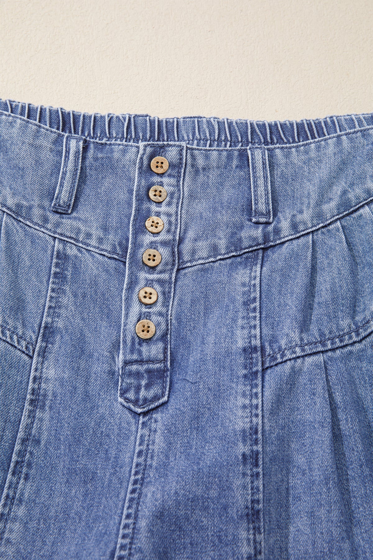 Dusk blue high-rise wide-leg denim jeans with pleats, buttons, and cropped length from Dear-Lover.