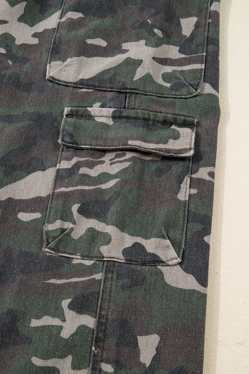 Green camo denim cargo wide-leg pants from Dear-Lover, featuring a relaxed fit, multiple pockets, and sturdy cotton-polyester fabric.