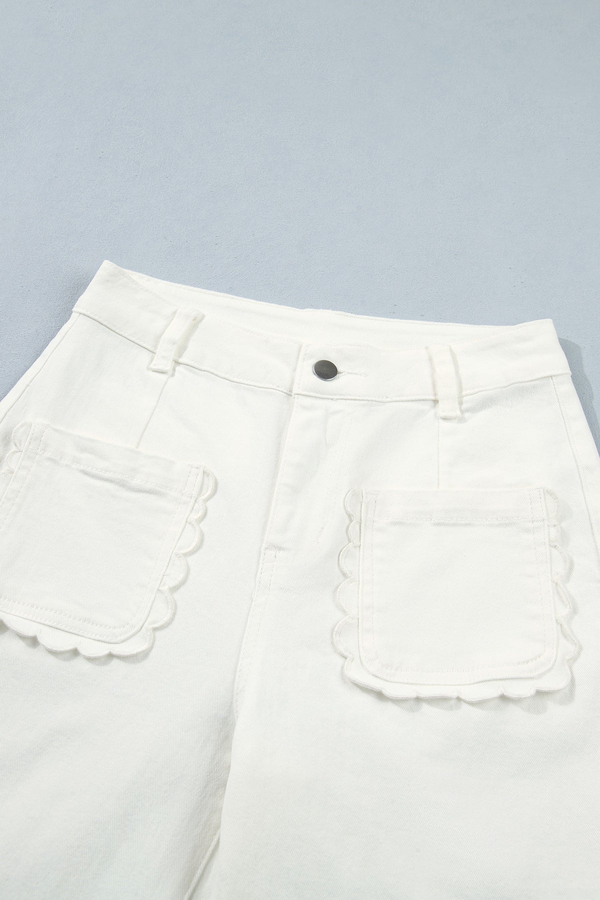 White Dear-Lover scalloped patch pocket shift jeans, casual bottoms with stylish details, made of cotton and elastane blend.