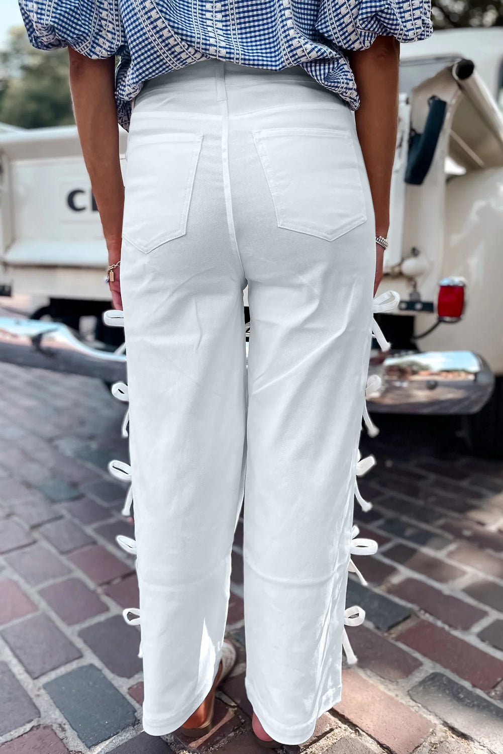 White Dear-Lover straight leg jeans with bow knot side detail and relaxed fit, made of cotton and elastane for comfort.